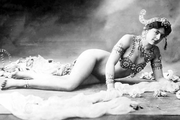 black and white photo of Mata Hari reclining in stage attire