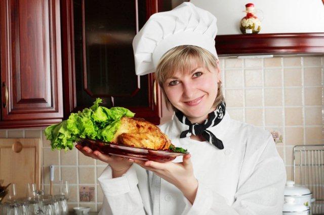 female personal chef holding a roast