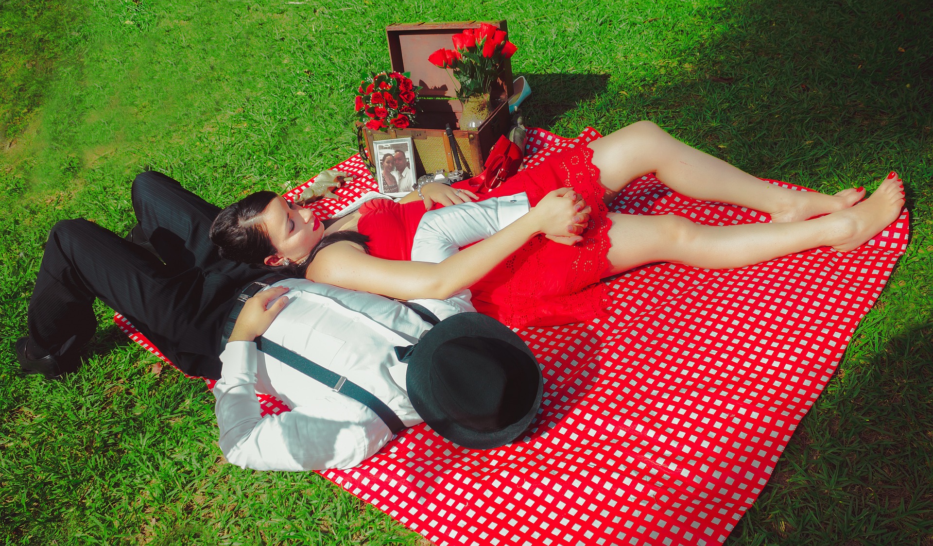 Couple lying on a picnic cloth